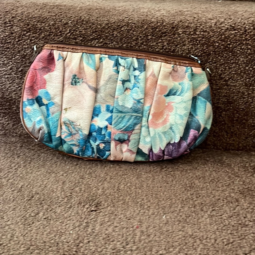Small Brighton cross body multi colored strap shows some wear and tear